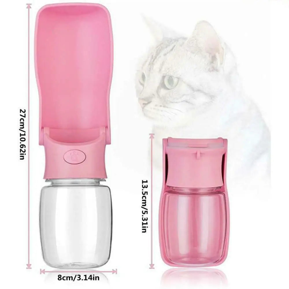 the image shows the portable water bottle for dogs and cats unfolded on the left with sizing that is 27cm/10.62 inches in length and 8cm/3.14 inches in width. on the right is the pink water bottle for dogs folded and its 13.5cm/5.31in long. the background is white and there is an almost transparent cat in the background as well