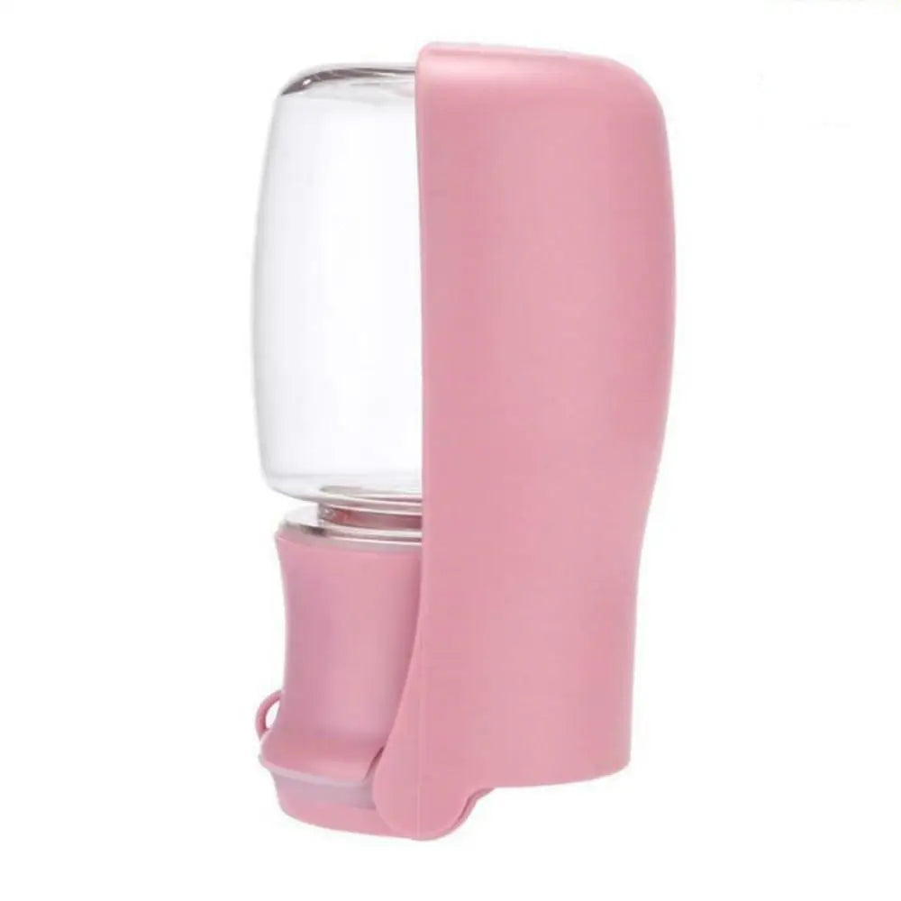 pink variant of the portable water and food bottle for dogs and cats. its a transparent container with a pink sink.