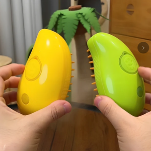 hands holding both variants of the steamy brush (yellow and green)